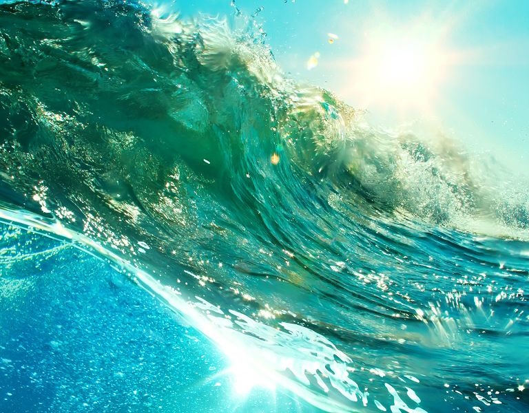 close-up-of-ocean-wave-reflecting-sunshine