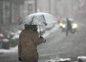 walking-in-the-snow-with-an-umbrella